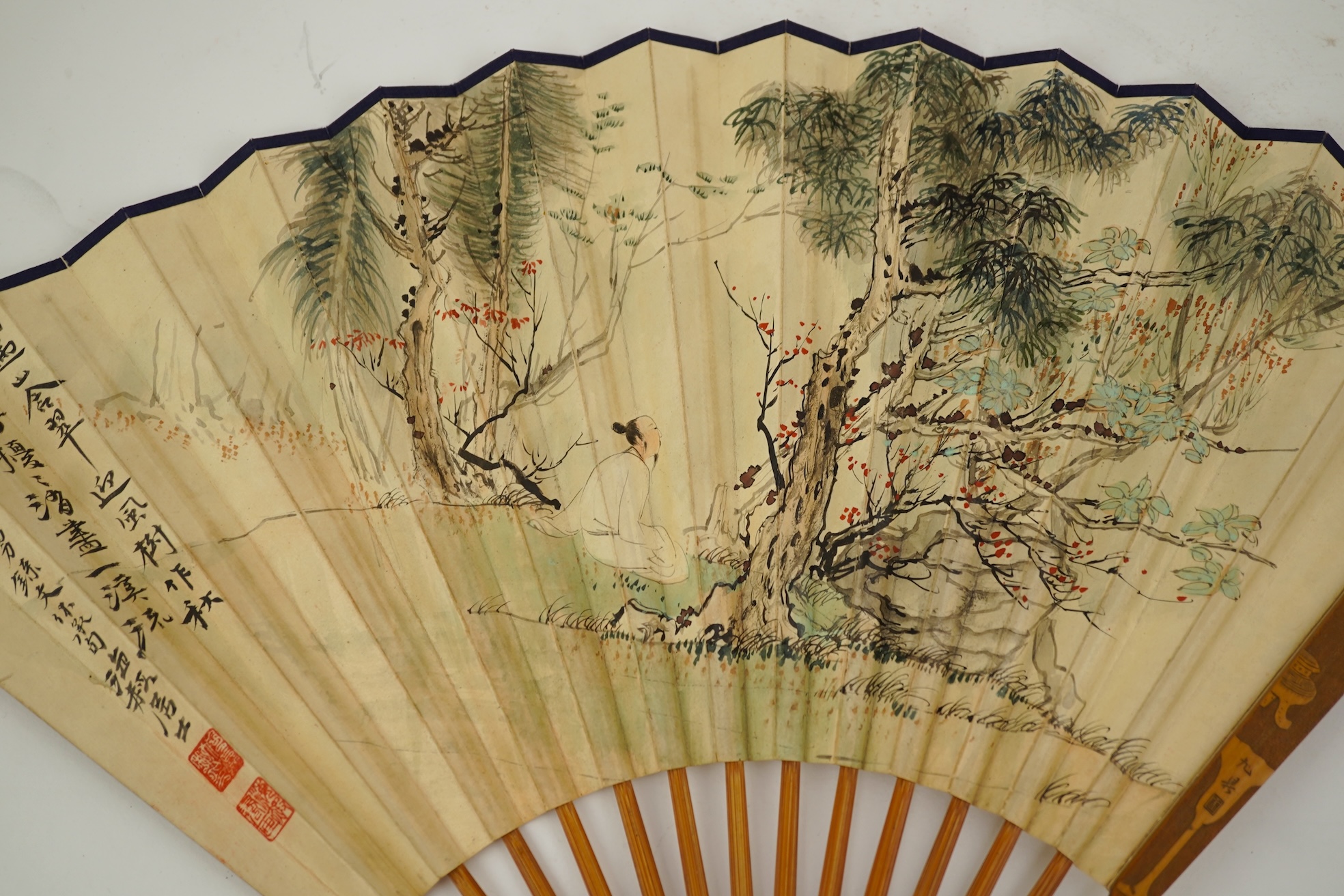 Two Chinese inscribed paper leaf fans, late 19th century